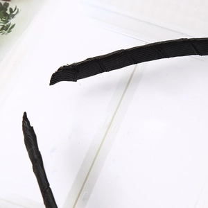 Black fabric-covered Halloween headband with ribbed texture for party headwear decoration