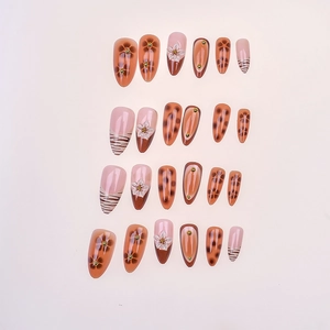 Almond press-on nails with leopard print, floral relief, and warm orange brown tones