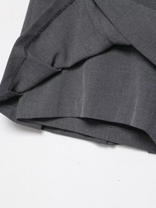 Detailed macro view of dark grey twill fabric texture with matching inner lining layer