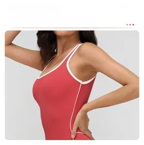 Detail of yoga bodysuit with contrast white trim and removable chest pads feature
