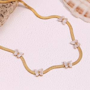 Detail view of 18K gold plated blade chain featuring five white shell butterfly pendants