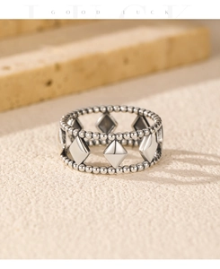 Macro detail of S925 sterling silver vintage geometric rhombus ring with beaded borders