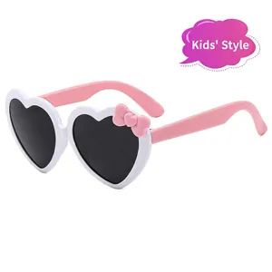 Cute heart-shaped kids sunglasses with pink bow and white frame for girls