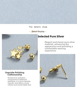 Detail view of gold star 925 silver studs with threaded ball backings and polished finish