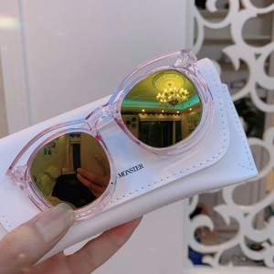 Pink resin sunglasses for kids with yellow mirrored lenses and white storage case