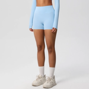 Close-up of light blue seamless high-waisted fitness shorts and matching crop top yoga set