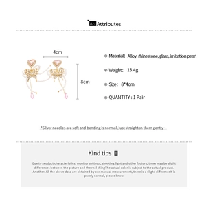 Detailed view showing crystal butterfly earrings dimensions 8x4cm with pearl tassels