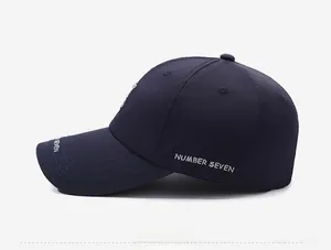 Close-up of Number Seven embroidery on a navy blue breathable baseball cap side view