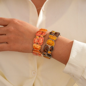 Ethnic geometric patchwork elastic bracelet with hammered texture in warm autumn tones