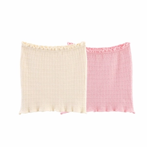 Close-up of knit tube top set with textured waffle pattern in cream and pink