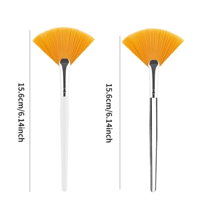 Set of two 15.6cm orange fan facial mask brushes with white and clear handles