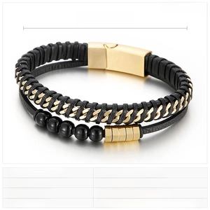 Detail of multi-layer black leather bracelet featuring gold stainless steel magnetic clasp