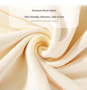 Close-up of soft cream plush fabric texture on children's fruit backpack