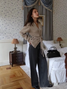 Elegant beige V-neck tied cardigan and charcoal wide-leg trousers for autumn style