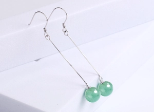 Detail view of long S925 silver threader earrings with green aventurine beads
