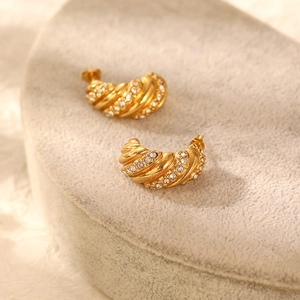 Golden C-shaped croissant earrings with twisted texture and crystal rhinestones