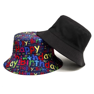 Dual-sided bucket hat with solid black and colorful Happy Birthday letter print patterns