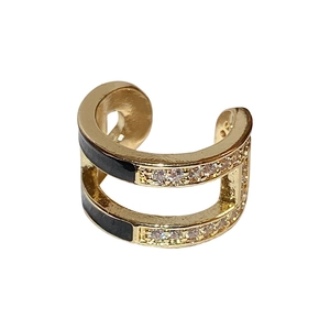Double-layered gold ear cuff with black enamel and sparkling zircon stones on white background