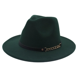 Detailed close-up of dark green felt fedora featuring a decorative gold chain and black band