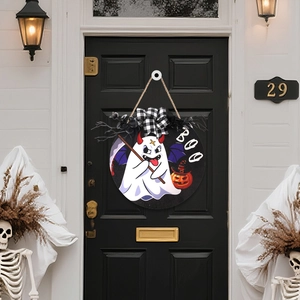 Close-up of Halloween BOO door sign with cartoon ghost, black bow and pumpkin on black door