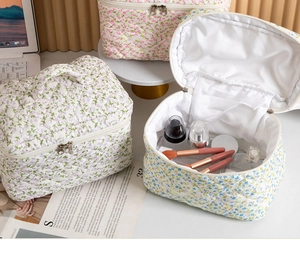 Quilted floral makeup bag detail showing large capacity and soft fabric texture