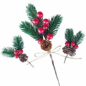 Detailed Christmas pine needles with red berries and natural pinecones on jute rope