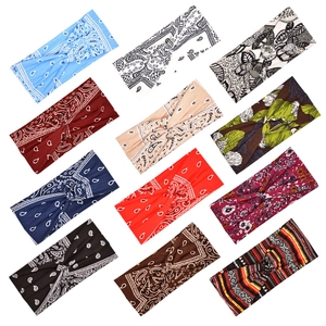 Detailed grid of 12 multi-colored paisley and floral elastic sports headbands