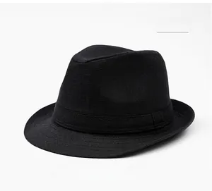 Macro detail of fine woven black fedora hat with matching ribbon and sun protection texture