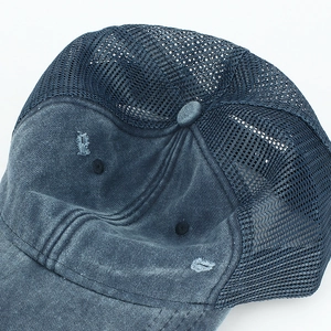 Distressed washed denim baseball cap with breathable mesh back and vintage torn detail