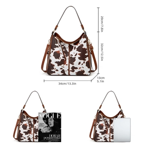 Detailed cow print tote bag size guide with magazine and tablet for scale comparison