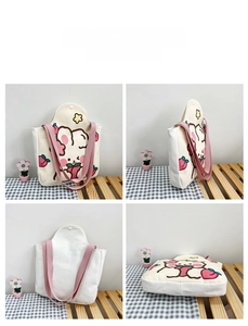 Detailed views of white canvas tote bag with pink cartoon rabbit pattern and snap closure