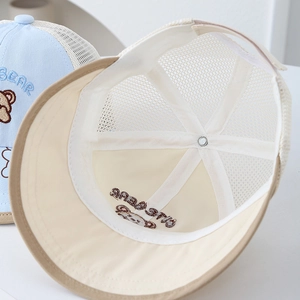 Detail view of breathable mesh and high-quality stitching on baby sun hats with bear embroidery
