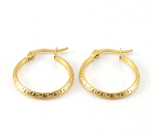 Detail of gold hoop earrings featuring a Greek fret pattern and secure clasp closure