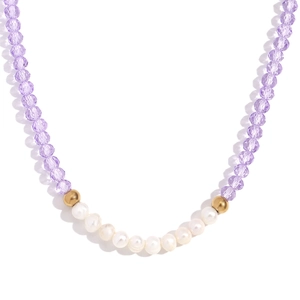 Handmade necklace with purple faceted crystal beads, freshwater pearls, and gold steel beads