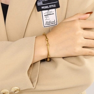 Adjustable gold twisted cable stainless steel bangle with five polished beads for women