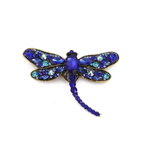 Vintage dragonfly brooch with dark blue crystals and antique gold alloy finish
