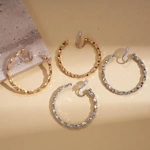 Minimalist geometric twisted faceted metal hoop clip-on earrings in gold and silver