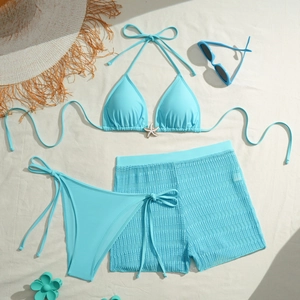 Three-piece light blue bikini set with halter top, bottom, and mesh cover-up shorts