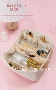 Detail showing inner compartments of a beige checkered leather makeup bag with cosmetics