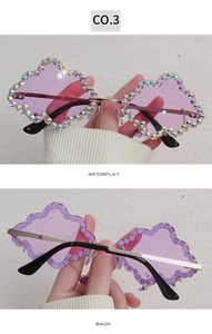 Detail of purple cloud sunglasses with AB rhinestones and gold metal frame