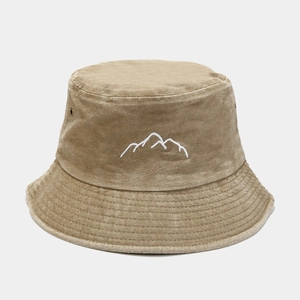 Detail shot of the mountain peak embroidery on washed khaki cotton bucket hat