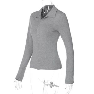 Detail of grey slim fit knit cardigan featuring a polo collar and buttoned cuffs