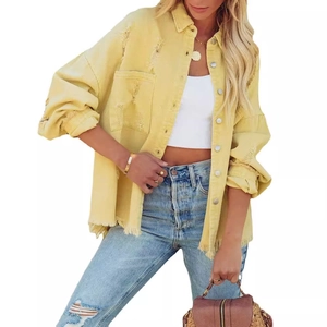 Women's yellow distressed denim jacket with frayed edges and ripped details on white