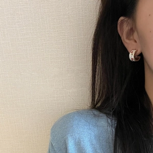 French vintage enamel tulip flower C-shape hoop earrings worn on a model's ear