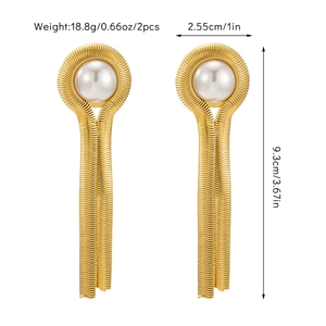 Detailed view of gold tassel earrings with pearls including 9.3cm length and weight specifications