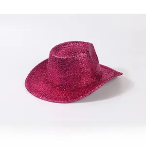 Close-up of vibrant pink glitter texture and shimmering sequins on a stylish cowboy hat
