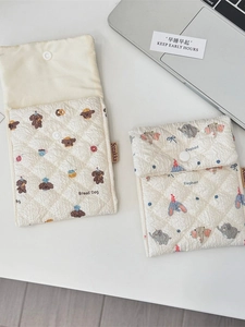 Quilted cotton storage pouches featuring cartoon bear and elephant patterns with snap buttons