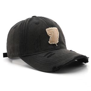 Distressed black cotton baseball cap with embroidered Change 7 patch and vintage style