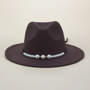 Detail of dark brown wool fedora hat featuring elegant pearl and diamond ribbon trim