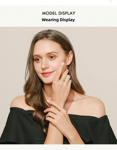 Model wearing a refined s925 silver ring featuring a rectangular light green gemstone